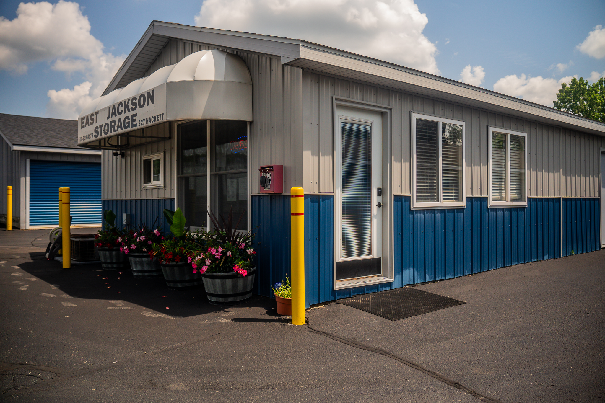 Storage Rental Office with an awning stating the name and number for the facility